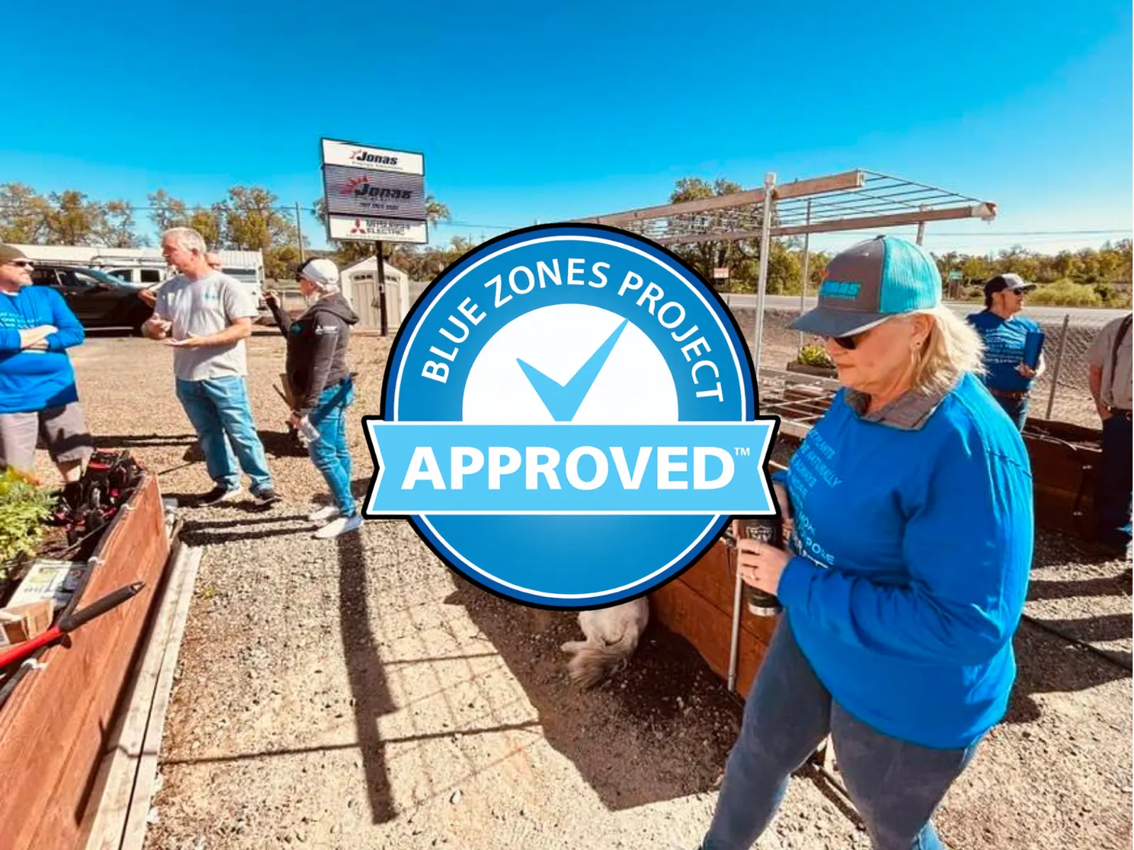 Jonas Energy Solutions team gathers outdoors celebrating their Blue Zones Project Approved™ certification, promoting health and well-being in Lake County.