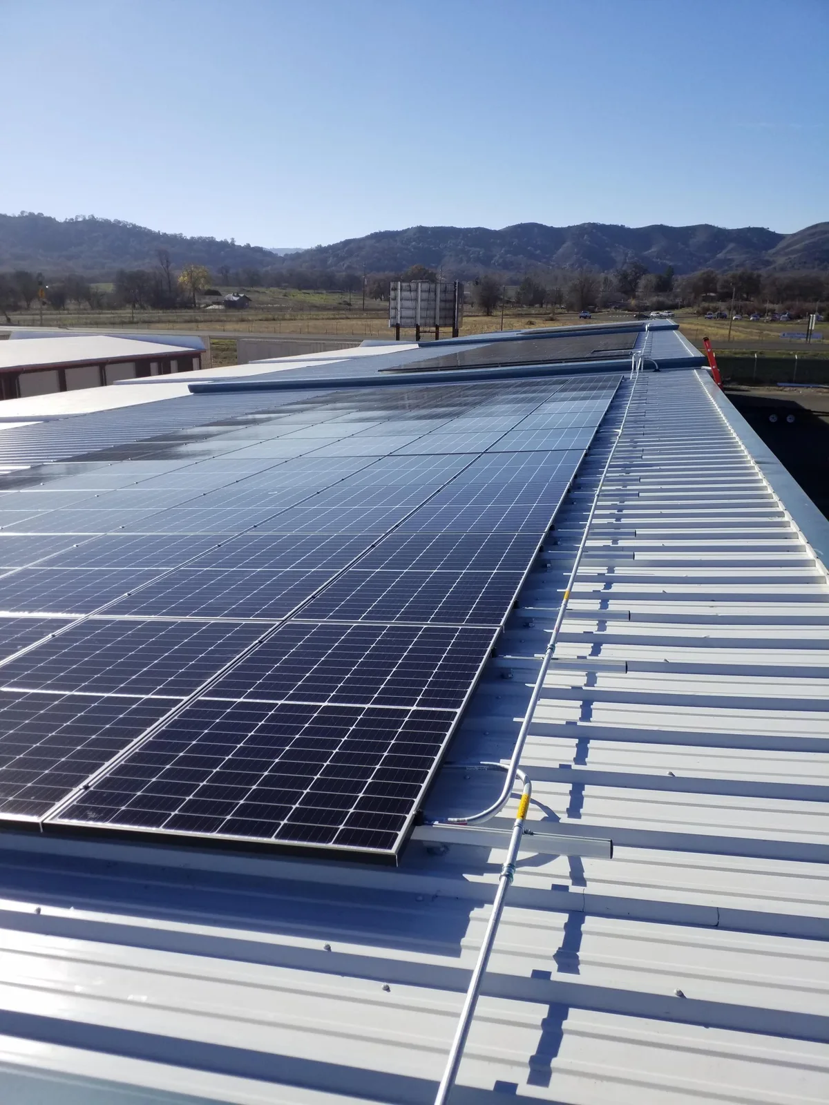 Roof-mounted solar panel installation