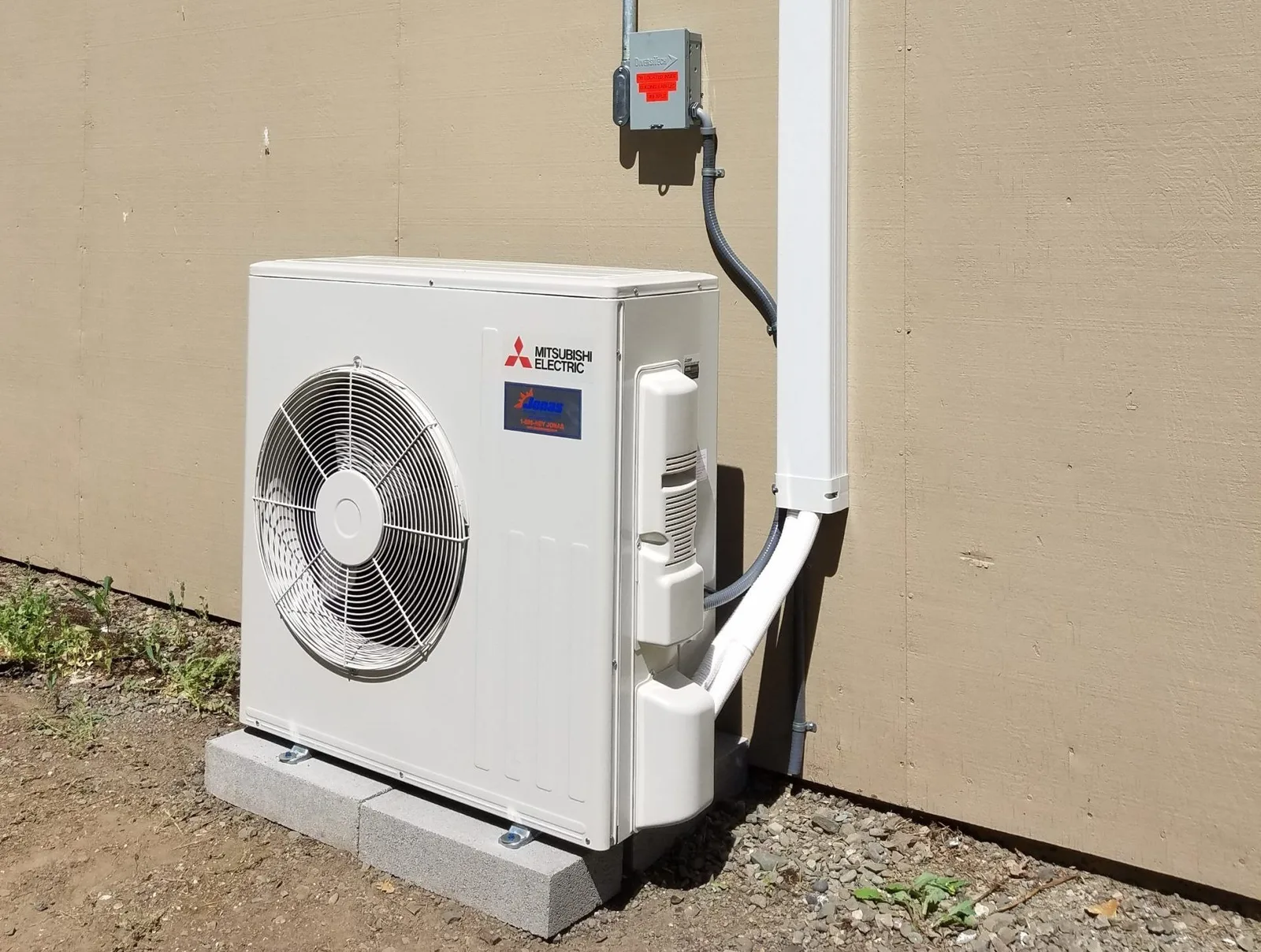 Mini-split system installed on a residential exterior