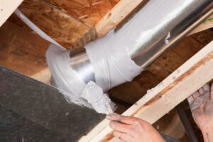 male-hand-applying-mastic-sealant-to-ductwork
