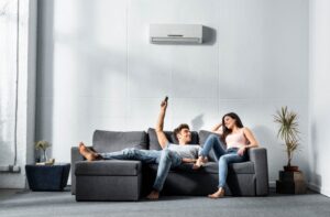 Two people enjoying ductless mini split air conditioning.